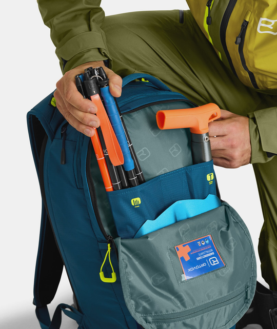 Compact blue Free Rider 22 backpack showcasing emergency gear storage and accessibility for outdoor activities.