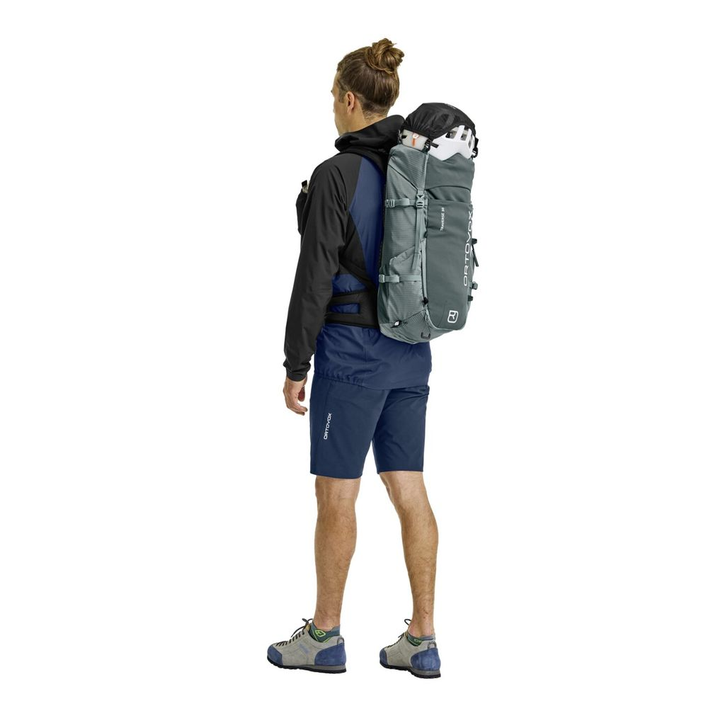 Versatile alpine backpack Traverse 30, worn by hiker, designed for balance and comfort.