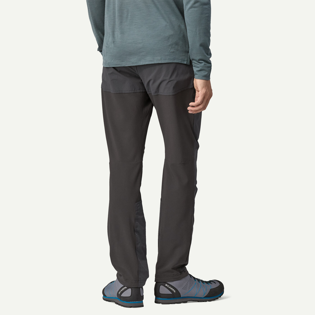 M's Terravia Alpine Pants shown from the back, featuring soft shell construction for climbing, with reinforced inserts and adjustable cuffs.