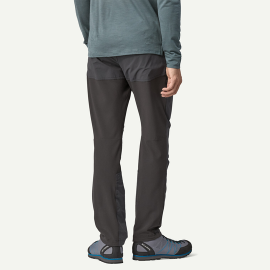 M's Terravia Alpine Pants shown from the back, featuring soft shell construction for climbing, with reinforced inserts and adjustable cuffs.