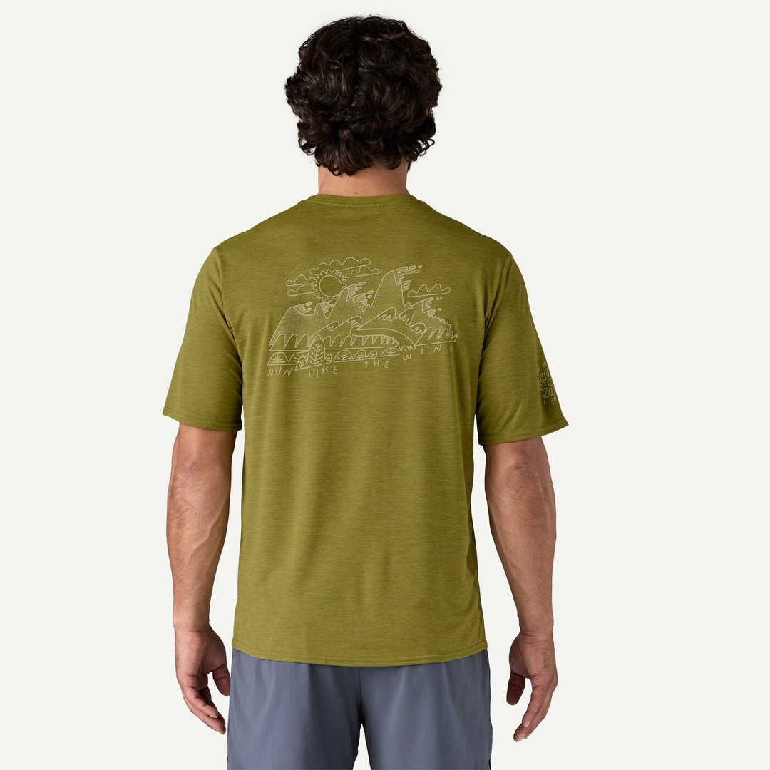 M's Cap Cool Daily Graphic Shirt in olive green with nature-inspired design on back, featuring short sleeves and breathable material for outdoor activities.