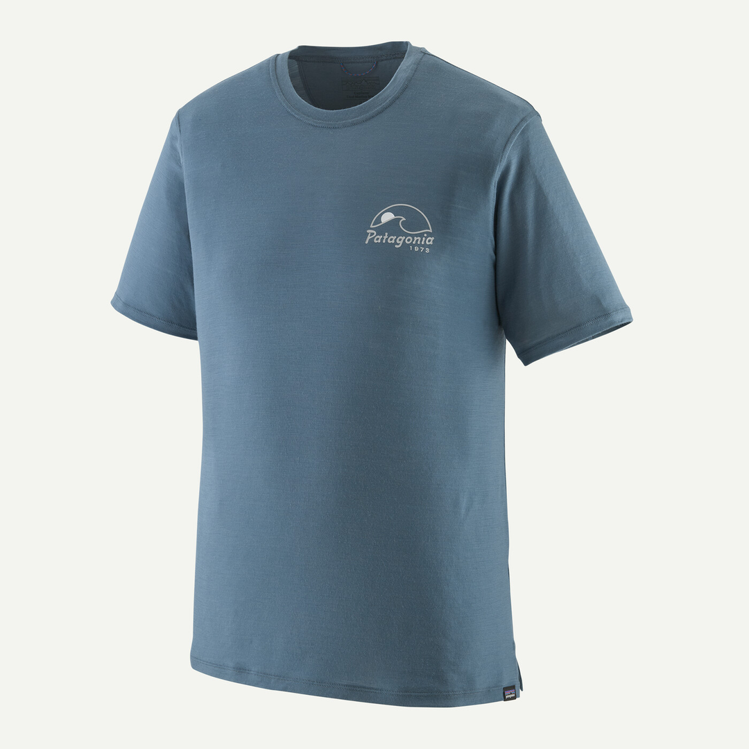 M's Cap Cool Merino Blend Graphic Shirt in blue, made from RWS certified merino wool and recycled polyester, featuring breathability, odor control, and enhanced mobility.