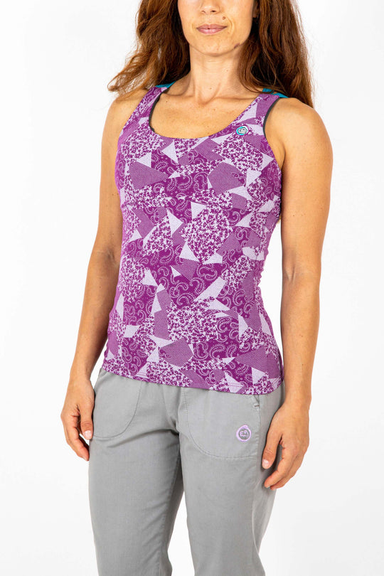Sleeveless top with built-in bra in purple geometric print, featuring elastic straps and front embroidery, made from organic cotton.