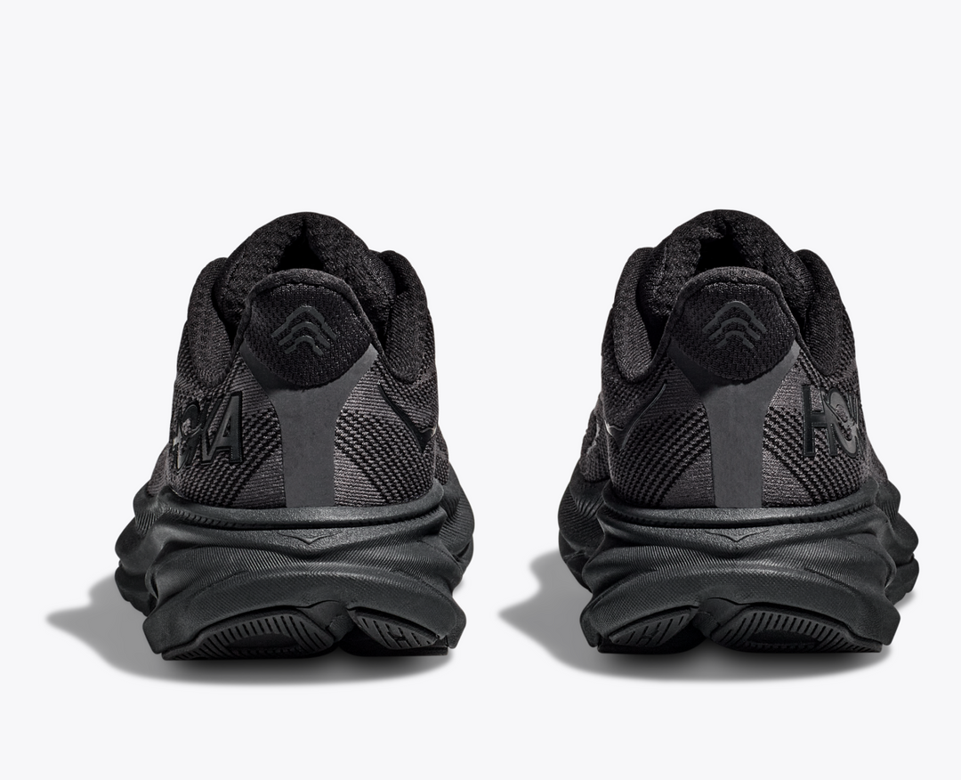 Clifton 9 running shoes in black, rear view showing reflective heel panel and cushioned sole.