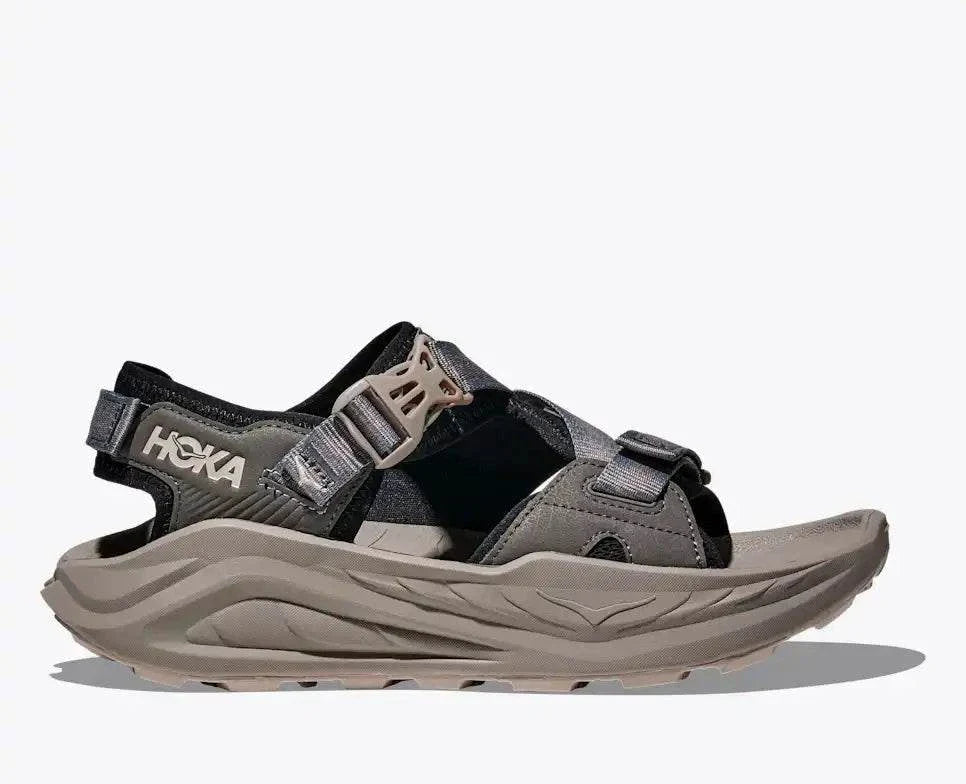 HOKA Infini Hike Tc sandal with Vibram Megagrip sole and adjustable straps designed for durable, quick-drying hiking on various terrains