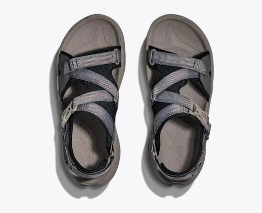 HOKA Infini Hike Tc open-toe sandal with adjustable straps, Vibram Megagrip sole, and Ariaprene upper for hiking