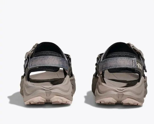 HOKA Infini Hike Tc open-toe sandal with adjustable straps and Vibram Megagrip sole for hiking