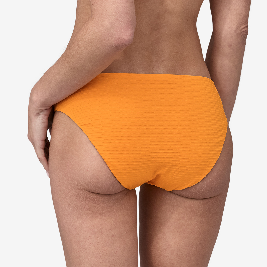 Sunamee Bottoms in vibrant orange, featuring a full-coverage back and high-cut hips, made from soft, stretchy recycled materials.