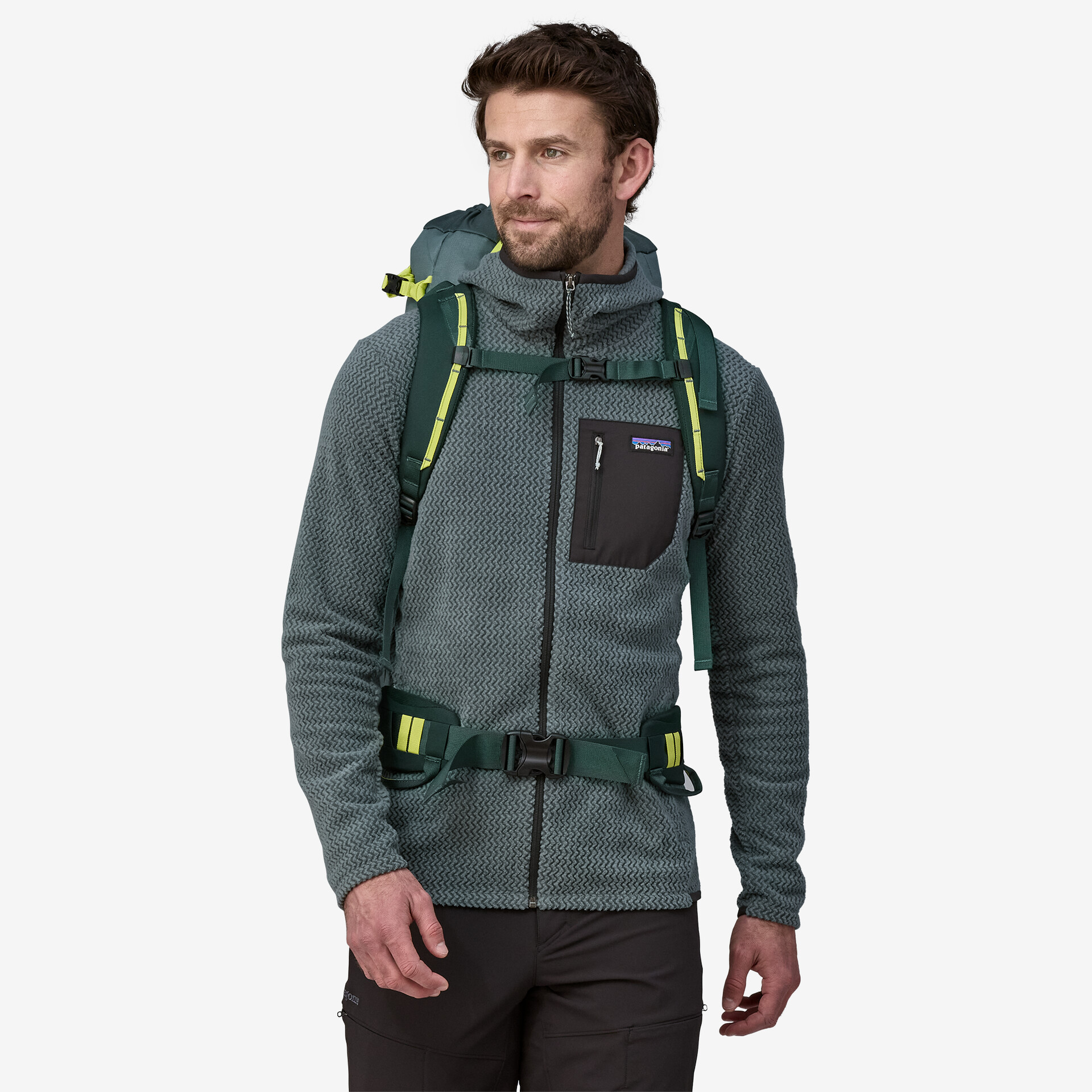 Ascensionist 35L backpack being worn by a person, showcasing its compact and functional design for alpine climbing.