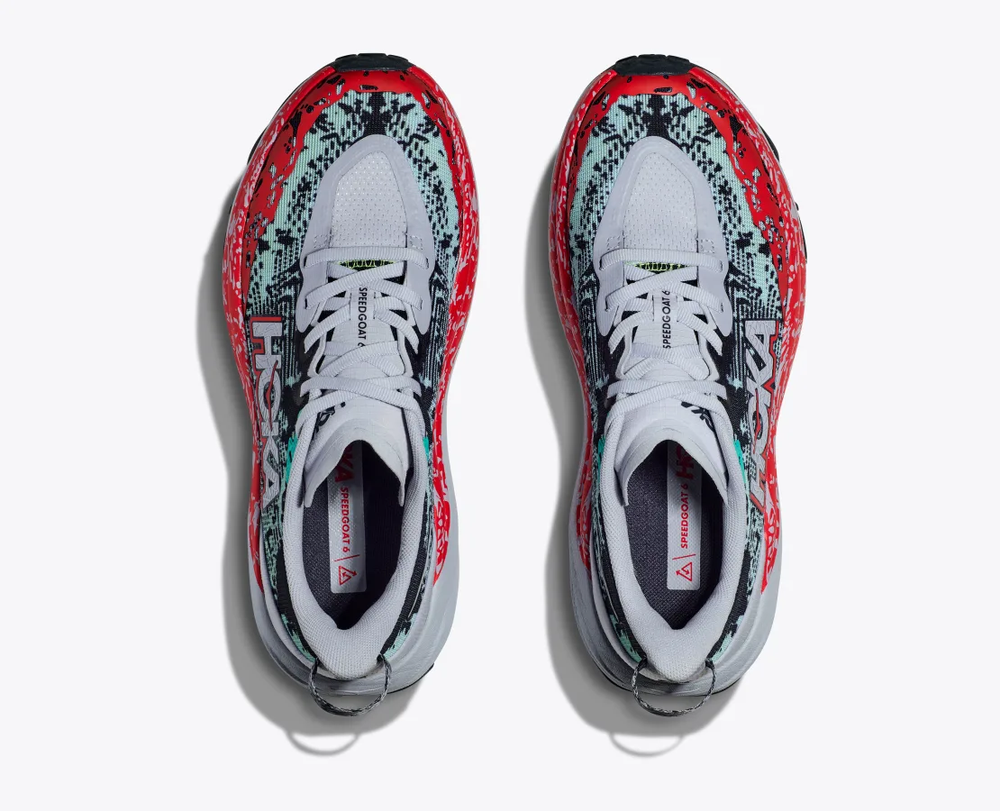 Top view of HOKA W Speedgoat 6 trail running shoes with vibrant red and black design.