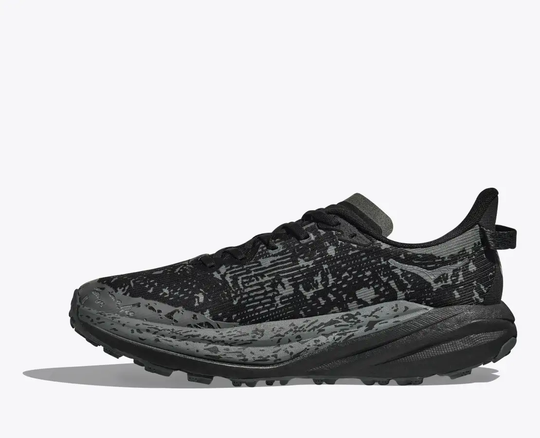 Speedgoat 6 Gtx trail shoe with GORE-TEX Invisible Fit, black design, durable Vibram® Megagrip outsole for wet conditions.