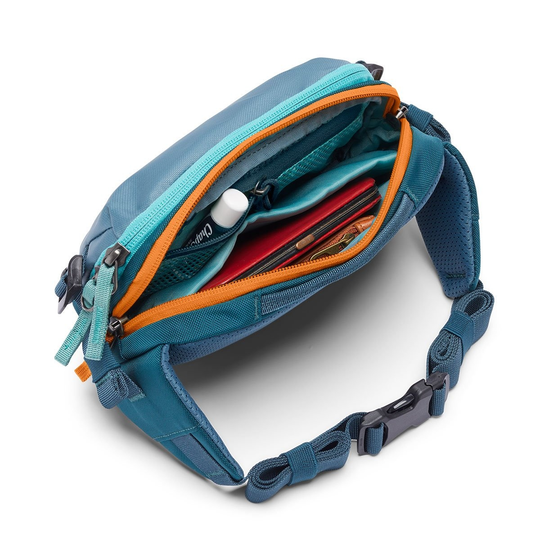 Allpa X 1.5L Hip Pack with dual-zippered main compartment open, showing inner pockets and adjustable waist strap.