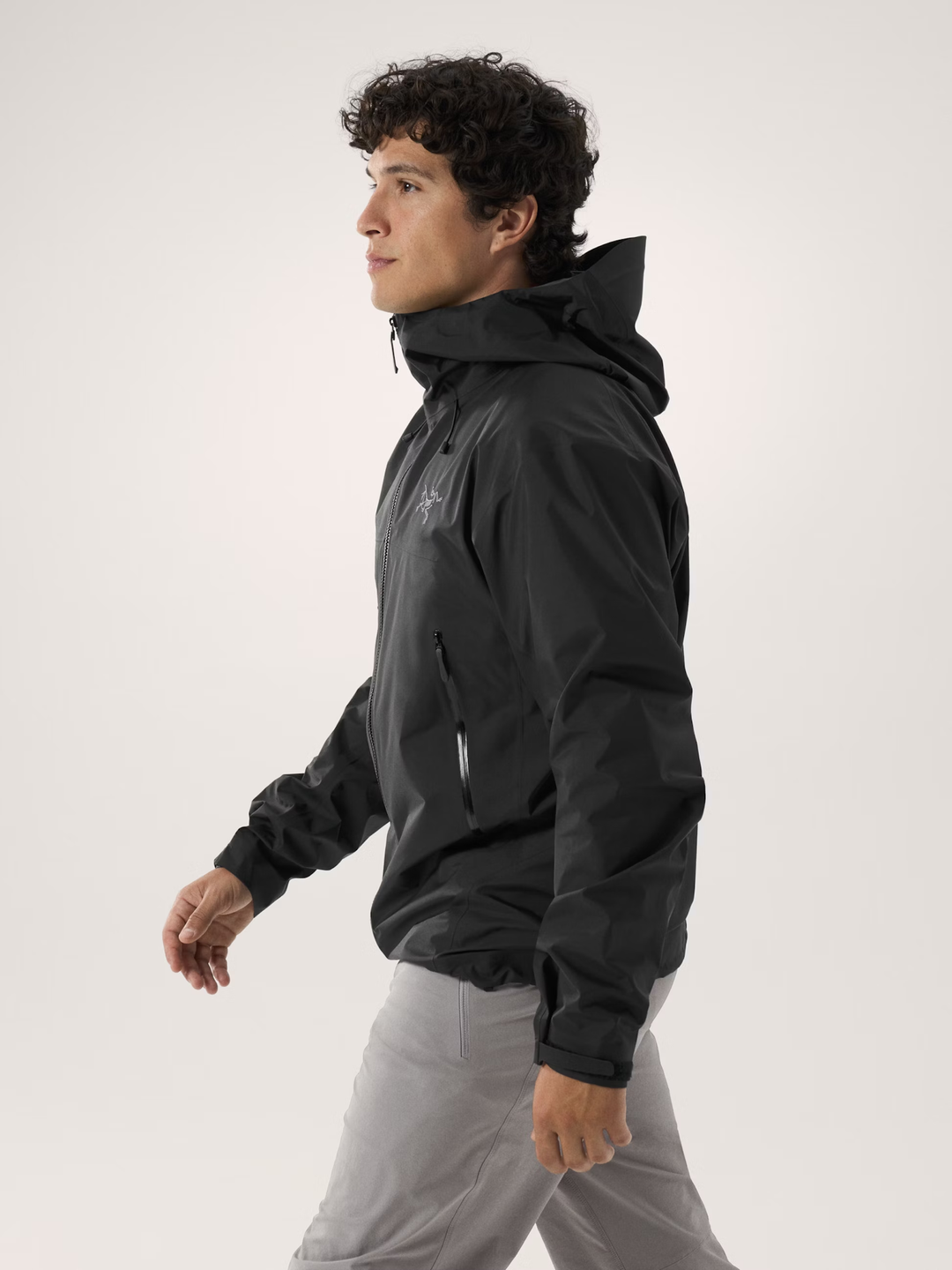 Lightweight Beta SL Jacket M worn by model, featuring waterproof, windproof, breathable GORE-TEX material, and StormHood.