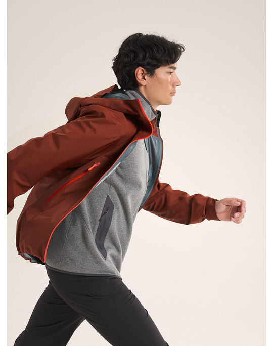 Beta SL Jacket M in action, lightweight and waterproof, designed for mountain conditions.