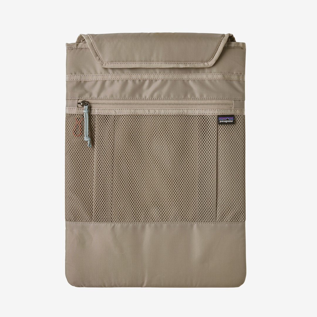 Refugio Day Pack 26L in beige, featuring a recycled polyester build, breathable back panel, removable laptop sleeve, and bike light clip.