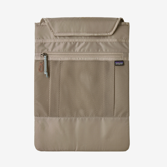 Refugio Day Pack 26L in beige, featuring a recycled polyester build, breathable back panel, removable laptop sleeve, and bike light clip.