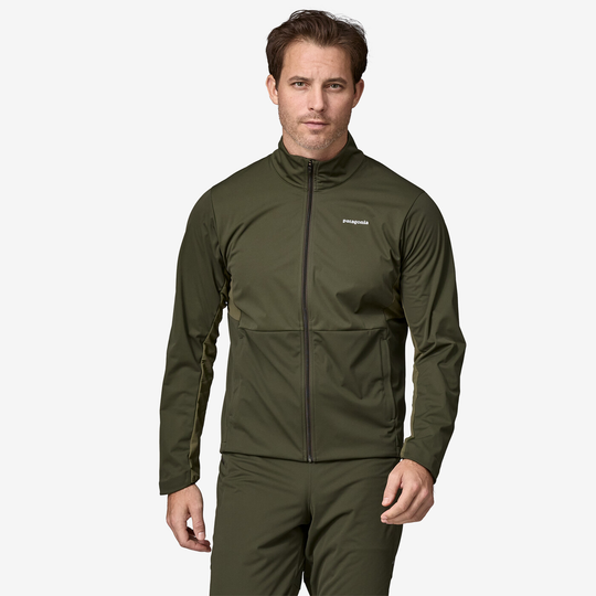 Wind Shield Jkt for men in green, designed for wind protection and breathability, with pockets and reflective logo.