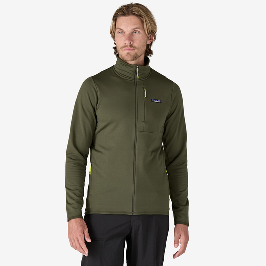 R1 Thermal Jkt in olive color, designed for cold alpine conditions, featuring breathable, stretchy fabric with wind and snow protection.
