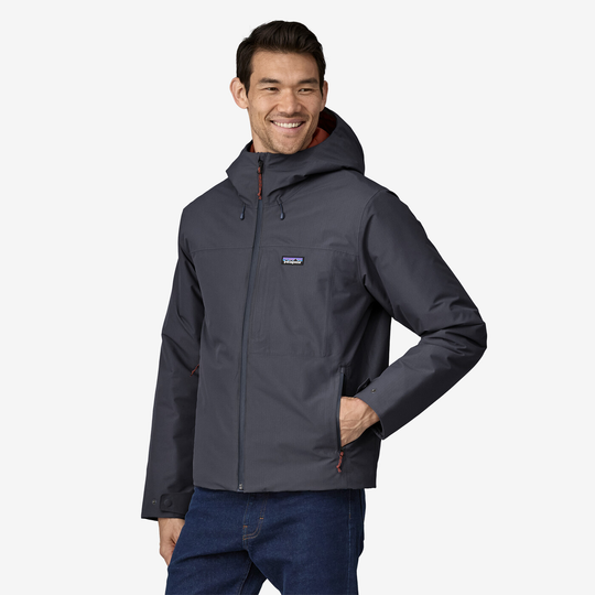 Men's Windshadow Jkt in dark grey with adjustable hood, zip front, and multiple pockets.
