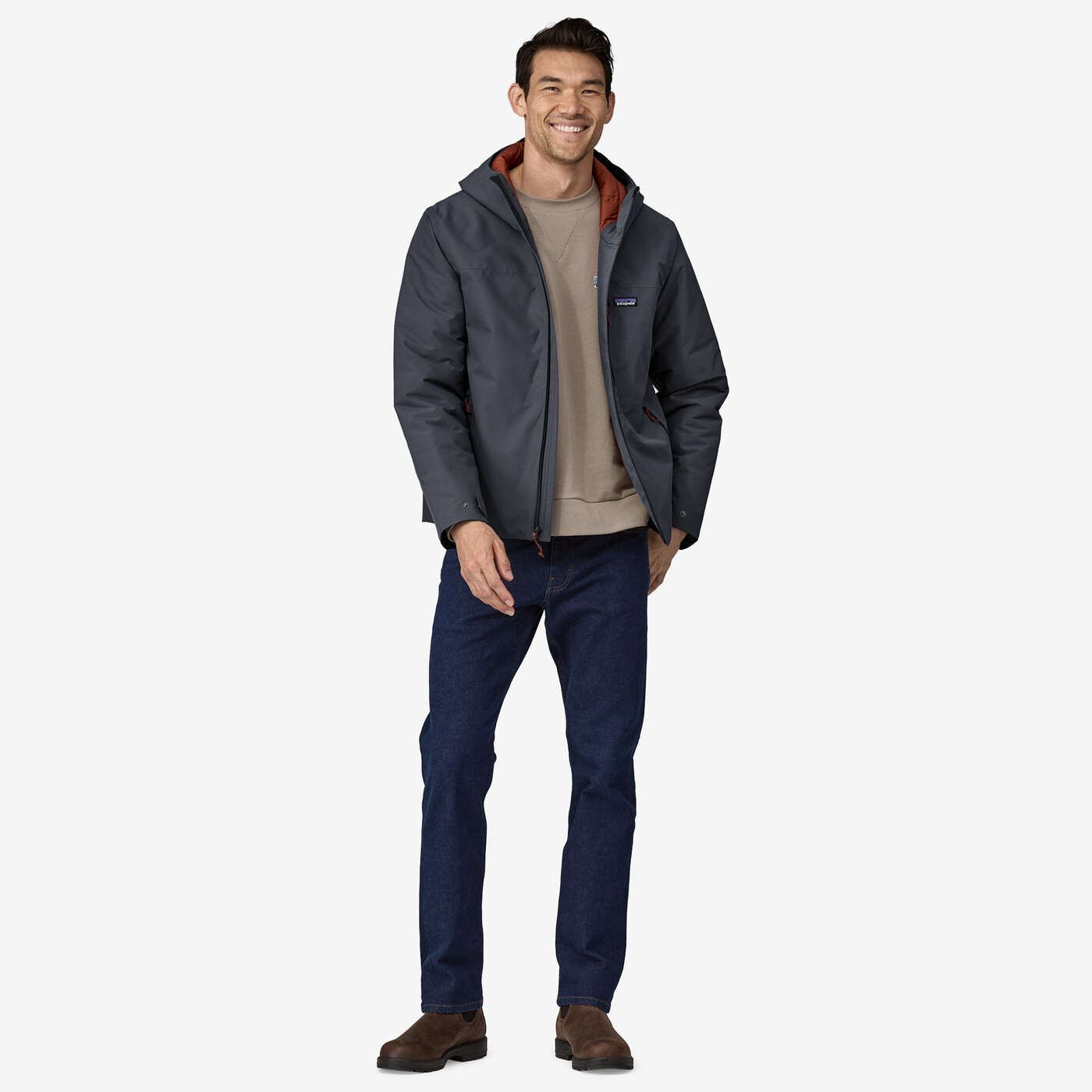 Men's Windshadow Jacket in dark color, featuring adjustable hood and cuffs, designed to be waterproof and insulated with recycled polyester for wet and cold conditions.