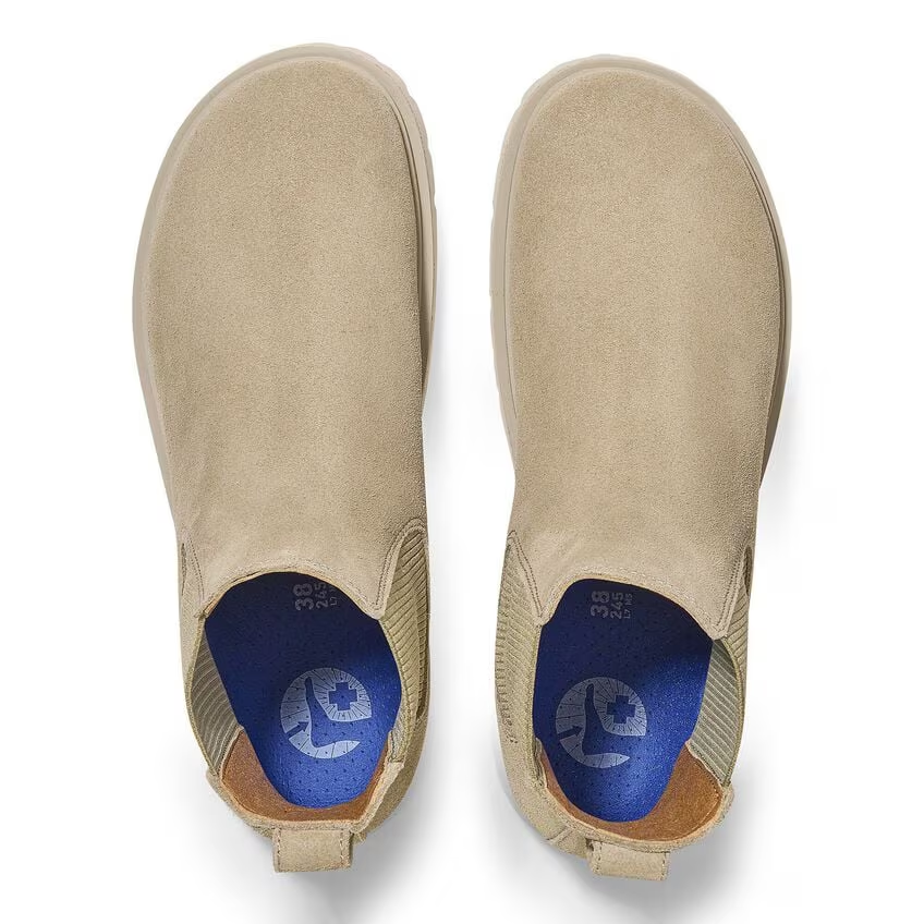 Suede leather slip-on shoes for women with cork sole and Deep Blue footbed.