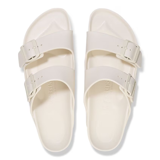 BIRKENSTOCK Arizona sandals in lightweight white EVA material.