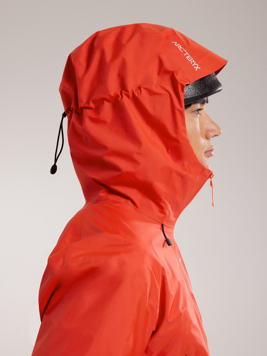Beta SL Jacket M in vivid red with helmet-compatible StormHood, side profile.