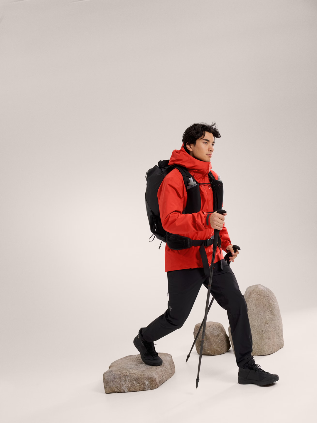 Beta SL Jacket M in red, worn outdoors, showcasing weather-resistant features.
