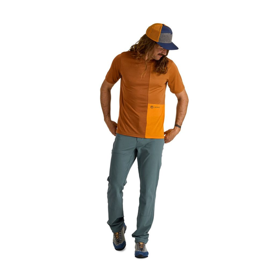 Merino wool T-shirt for rock climbing with a man in a cap.