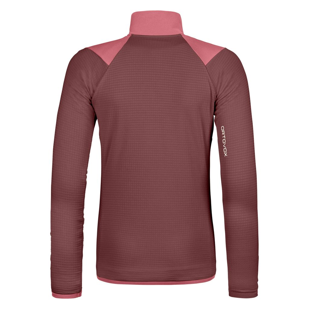 Women's technical fleece grid jacket with merino wool, breathable fabric, and chest pockets for mountain hiking.