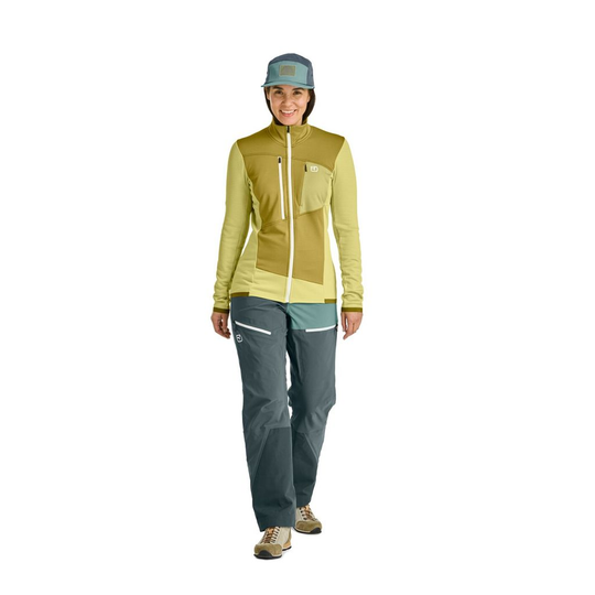 Women's fleece grid jacket for mountain tours, providing warmth, breathability, and freedom of movement.