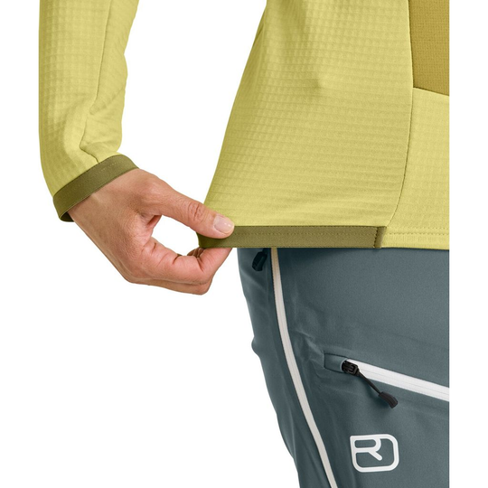 Close-up of the Fleece Grid Jacket showing waffle structure and backpack-compatible pocket.