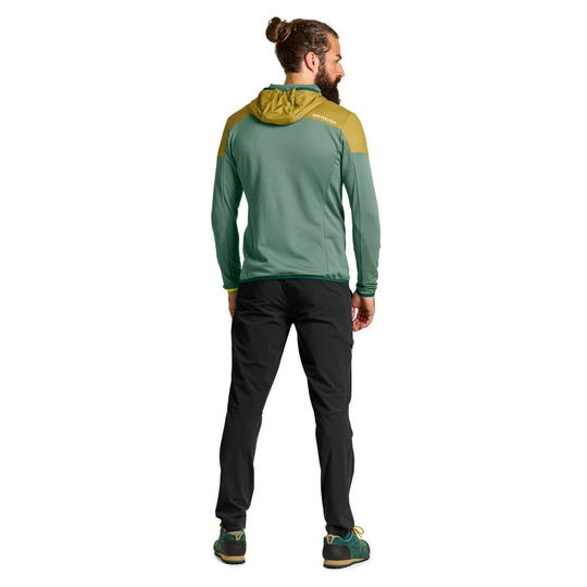Ladiz Hybrid Jacket M in green with yellow hood, athletic fit, designed for alpine use with Merino wool and windproof inserts.
