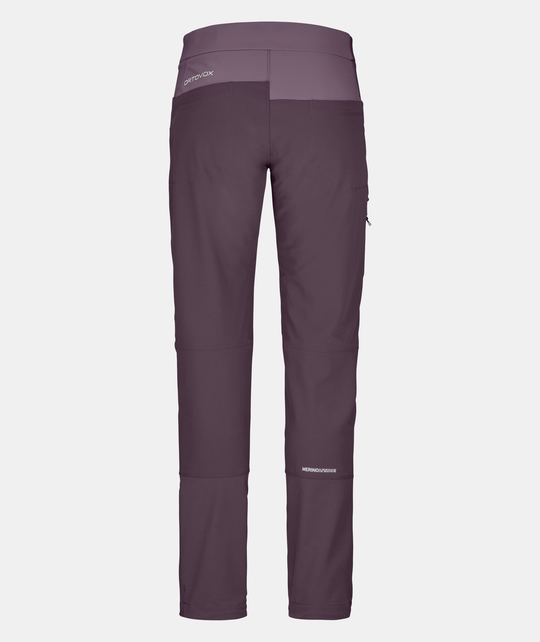 Women's Pala Pants featuring durable, breathable fabric, quadri-stretch material, Merino wool inserts, and reinforced knees for alpine climbing.