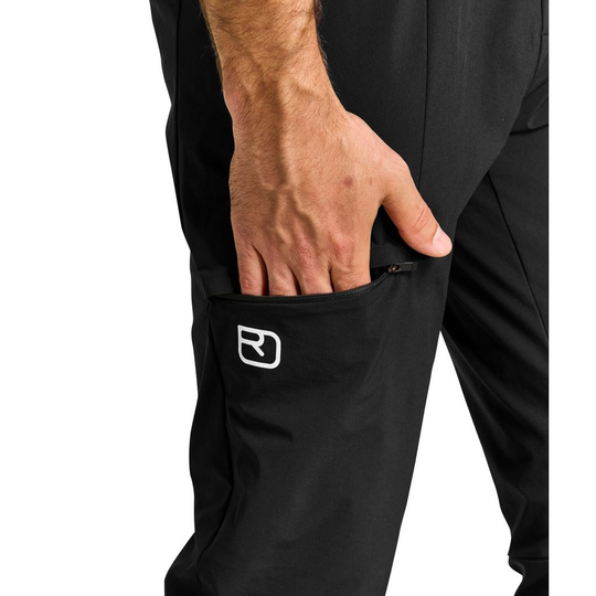 Lightweight Piz Selva Pants for men, ideal for summer alpine adventures with stretch fabric and abrasion resistance.