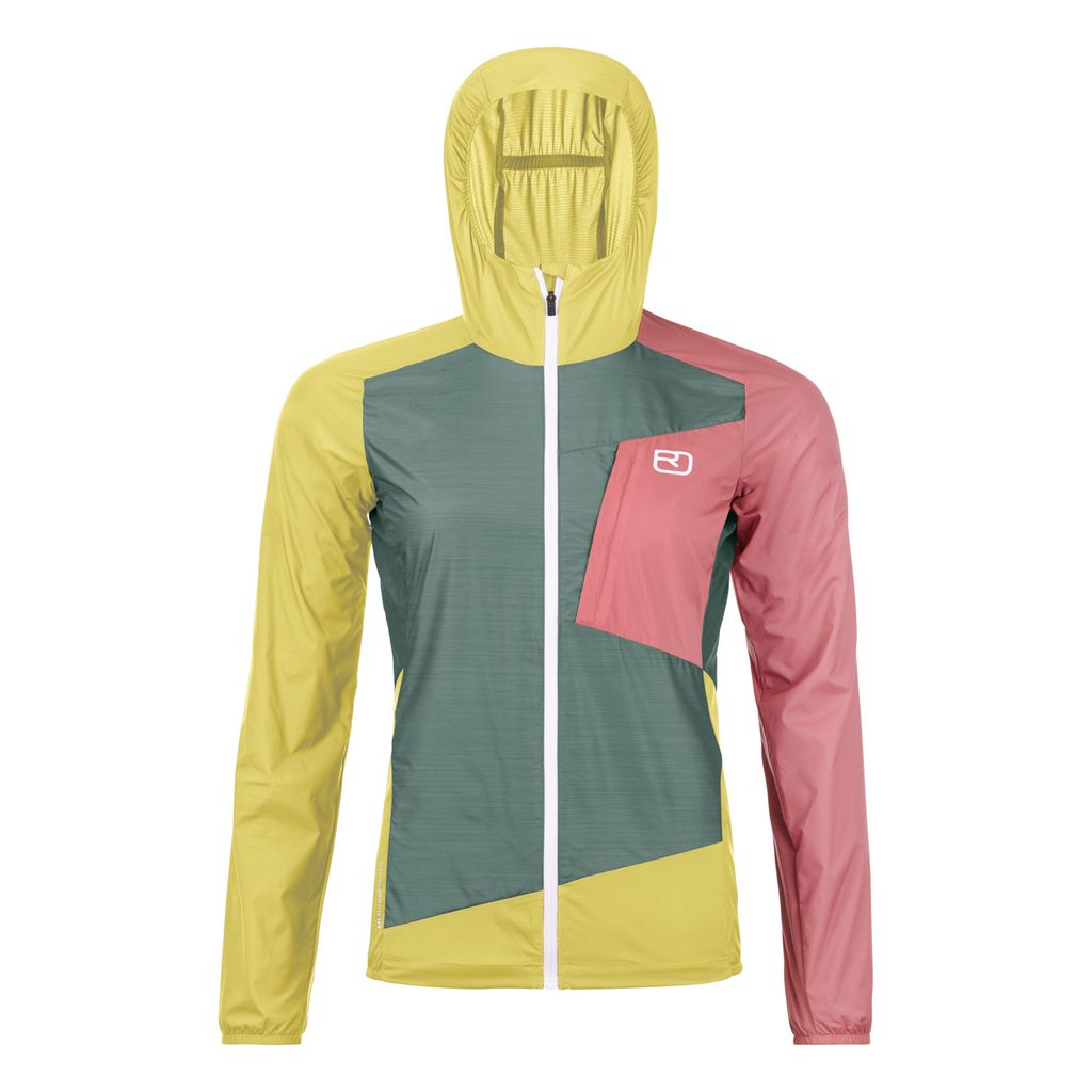 Lightweight women's windbreaker jacket with Merino wool for wind and water resistance, featuring a self-adjusting hood and compact design.