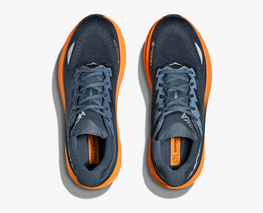 Clifton 9 Gtx running shoes with GORE-TEX, navy mesh, and orange soles.