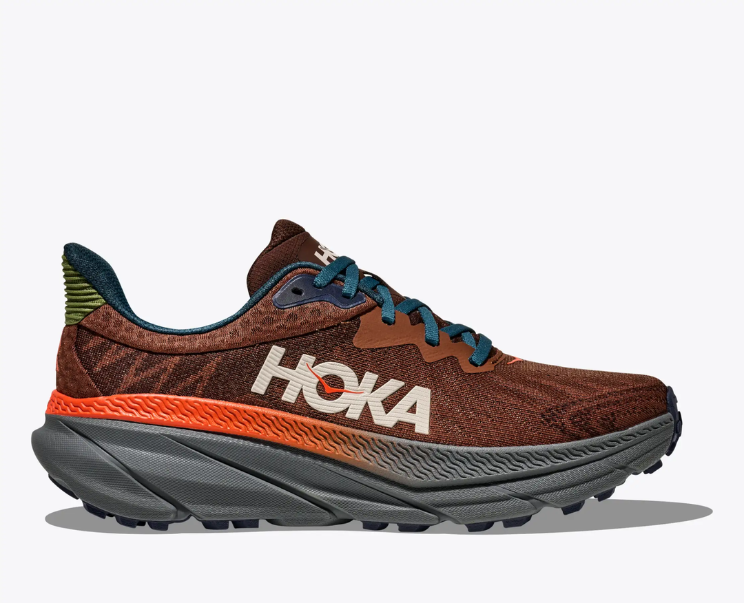 M Challenger 7 shoe, brown and orange trail running sneaker with mesh upper and rugged sole.