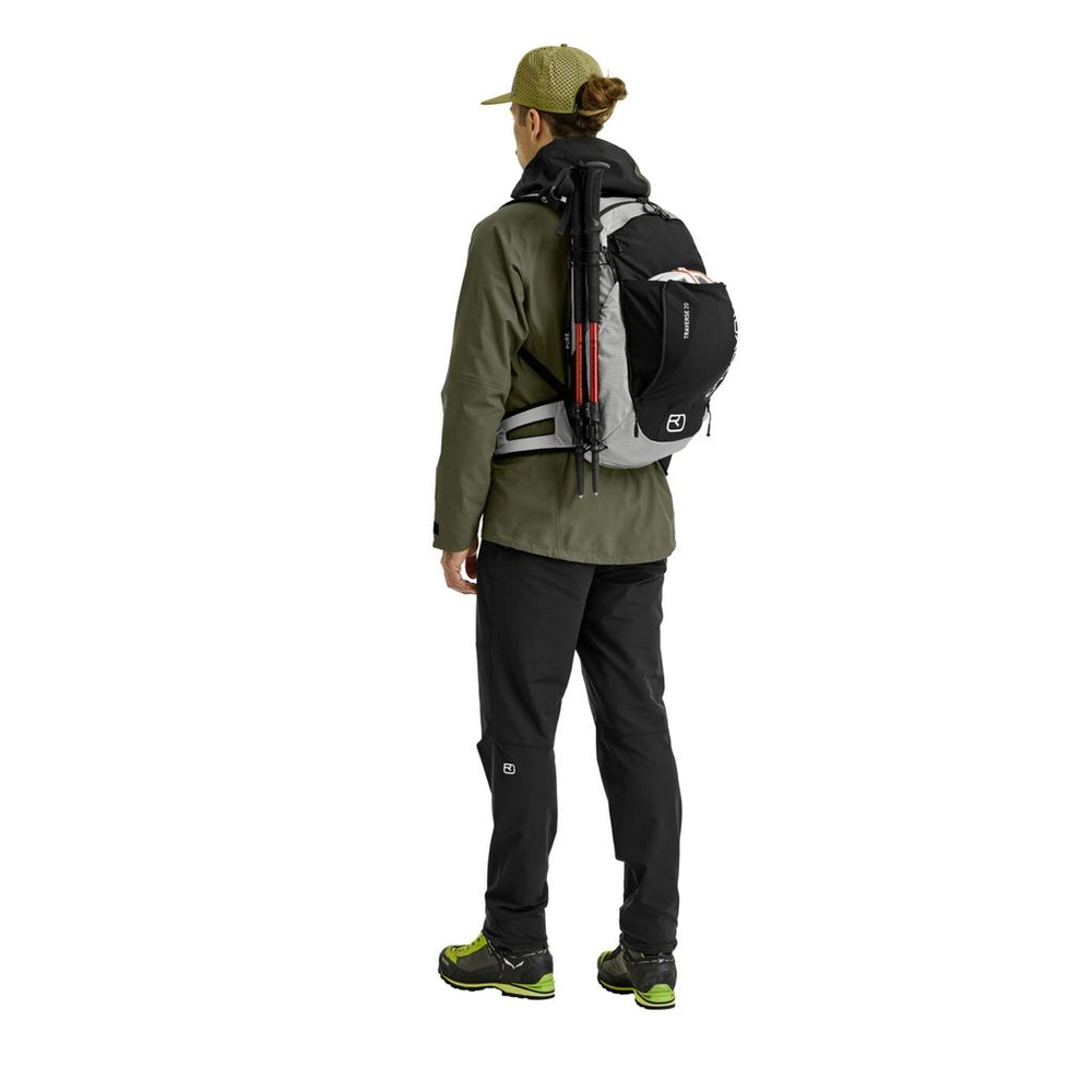 Versatile alpine backpack Traverse Pure 20 worn by hiker, featuring ergonomic design and eco-friendly materials.