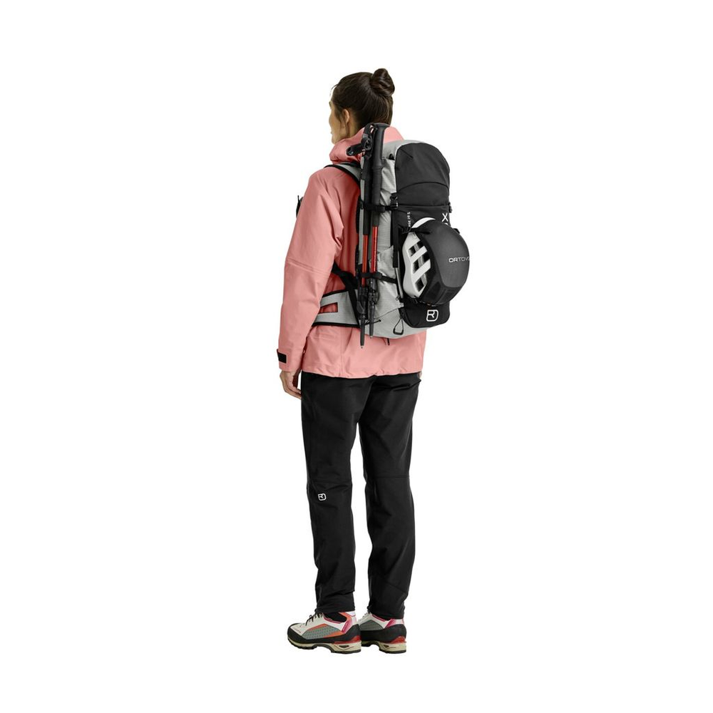 Versatile Traverse Pure 28 S backpack for alpine adventures, features helmet net, ergonomic straps, and recycled materials.