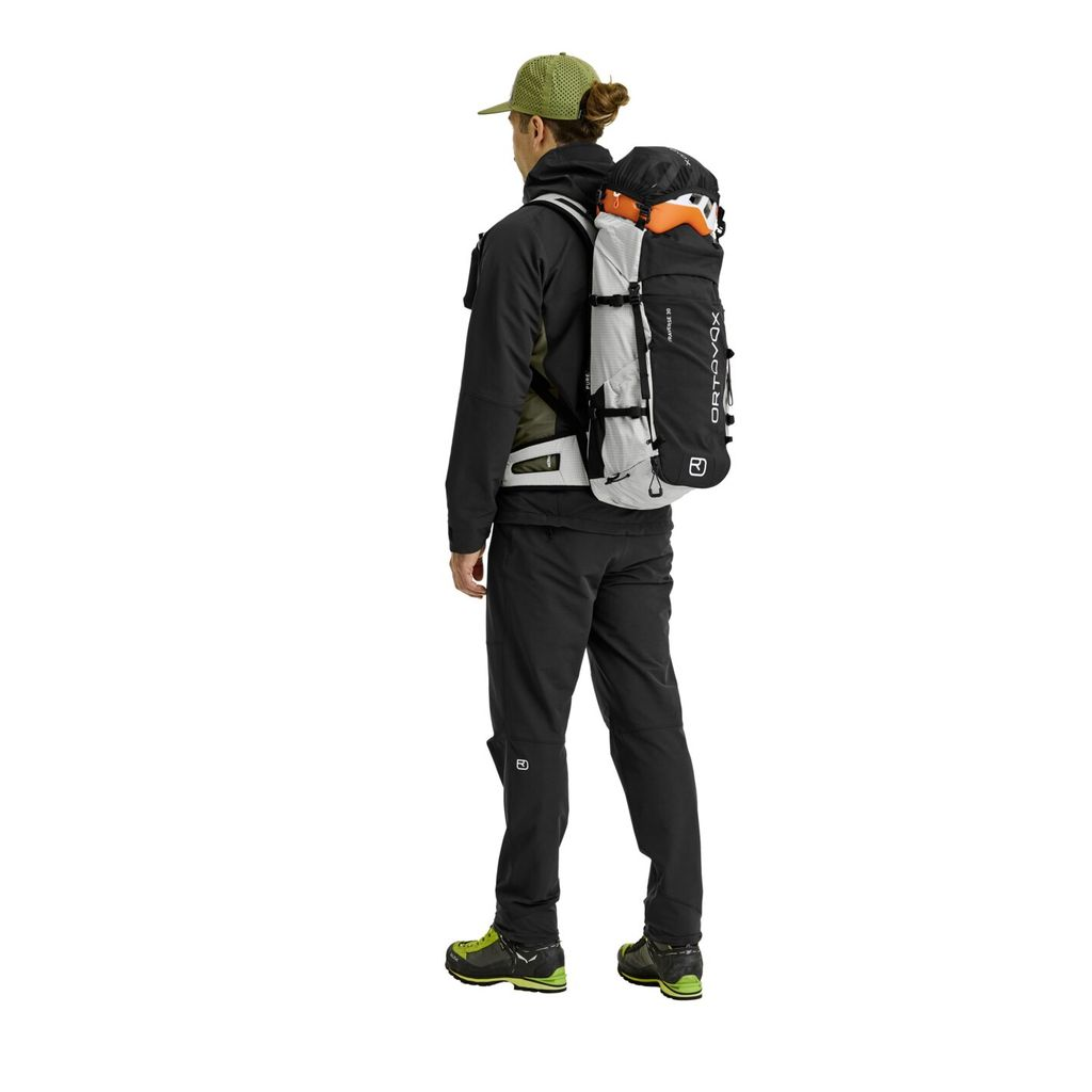 Versatile Traverse Pure 30 alpine backpack worn by hiker.