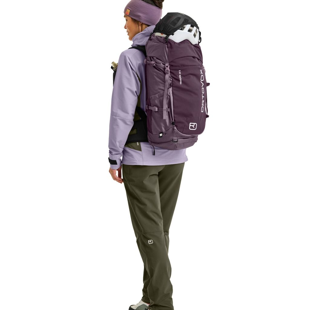 Traverse 38 S hiking backpack with helmet holder, ergonomic straps, and multiple compartments for gear storage.