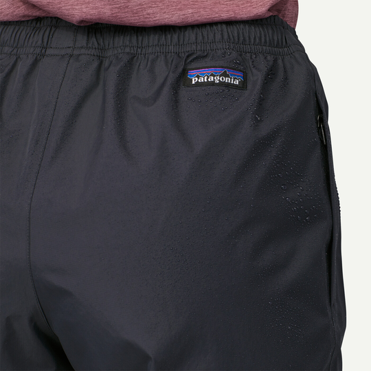 Water-resistant Patagonia Torrentshell 3L Rain Pants with reinforced waistband.