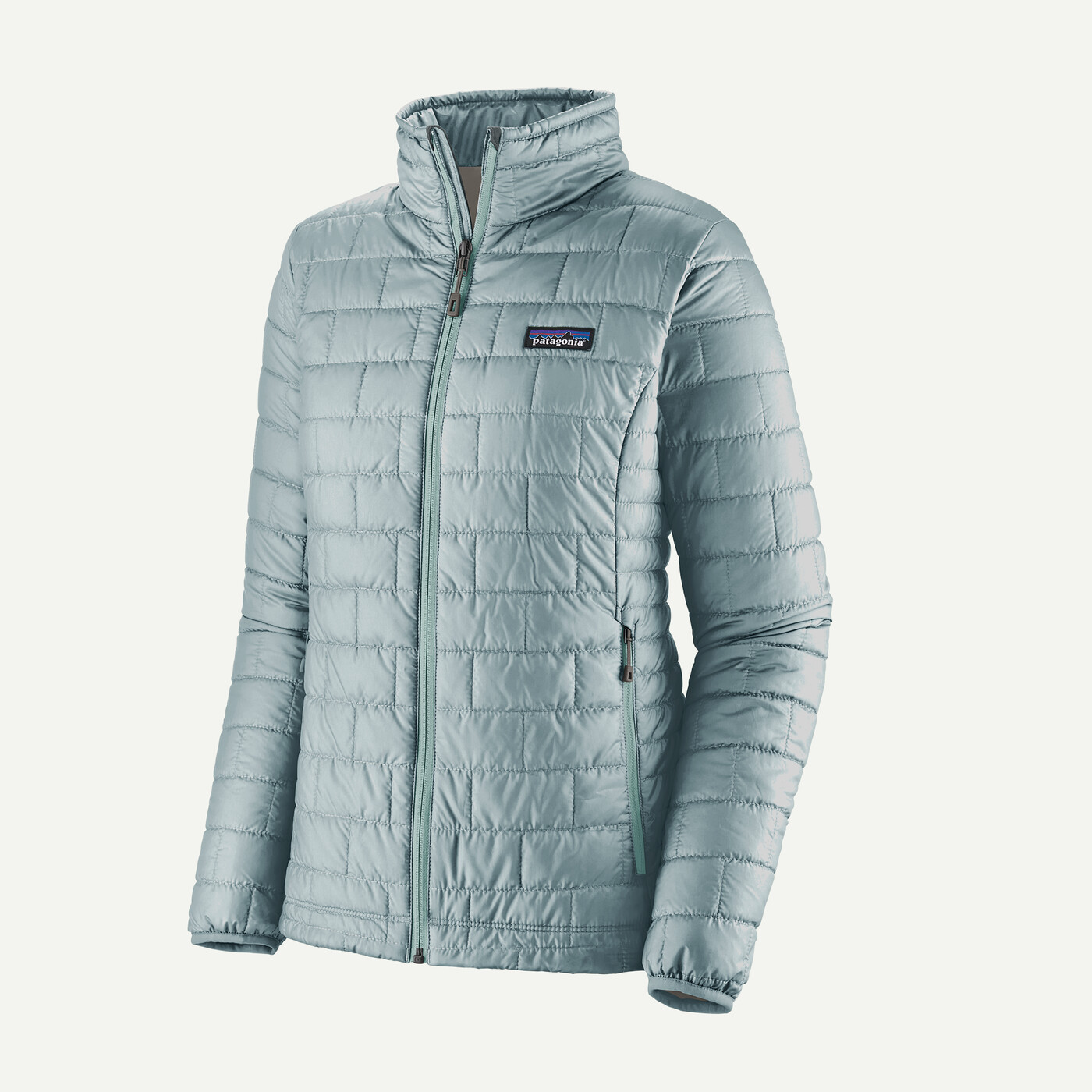 Light blue Nano Puff Jkt with horizontal quilting, made from recycled polyester, front zip, hand-warmer pockets, Fair Trade Certified.