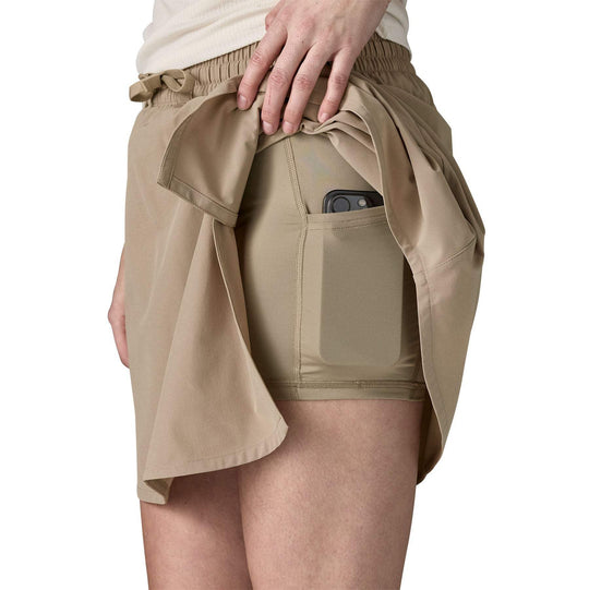 W's Fleetwith Skort with integrated shorts, elastic waist, adjustable drawcord, and hidden zip pocket.
