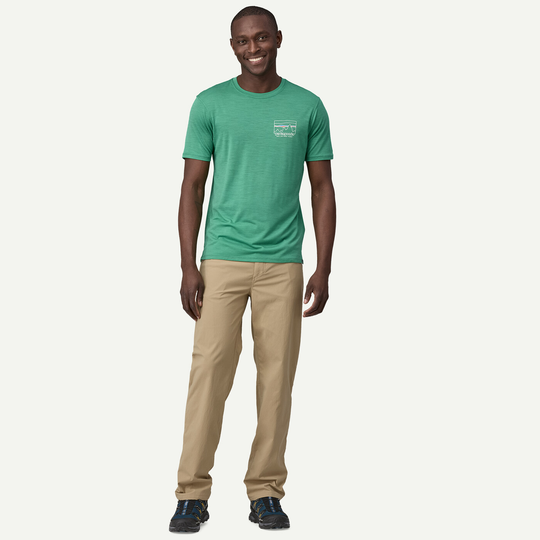 M's Quandary Pants in beige, regular fit, lightweight recycled nylon fabric with UPF 40+ protection, featuring multiple pockets and reinforced loops.