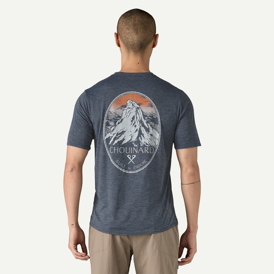 M's Cap Cool Daily Graphic Shirt with mountain graphic, versatile and quick-drying, made from recycled polyester, Fair Trade Certified.