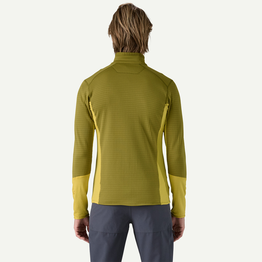 Lightweight and compressible R1 Jkt in yellow-green, breathable technical fleece ideal for cold mountain activities.