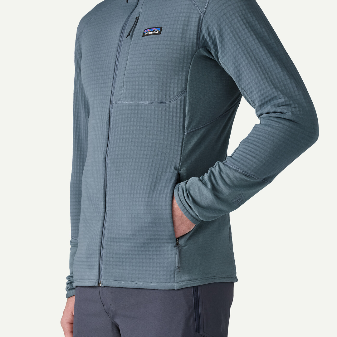 Patagonia R1 Jkt worn by a person, showcasing lightweight Polartec Power Grid fabric, ideal for cold mountain activities.