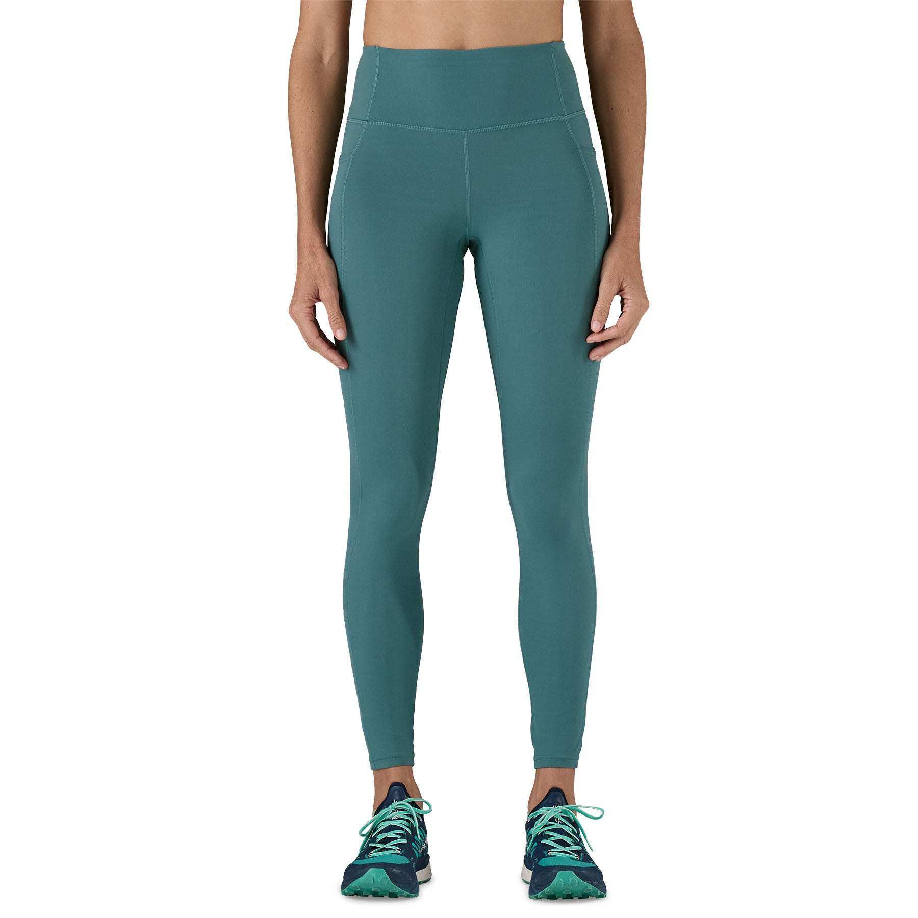 W's Maipo 7/8 Stash Tights in green, high-waisted, versatile leggings featuring recycled nylon, breathable fabric, and side pockets.